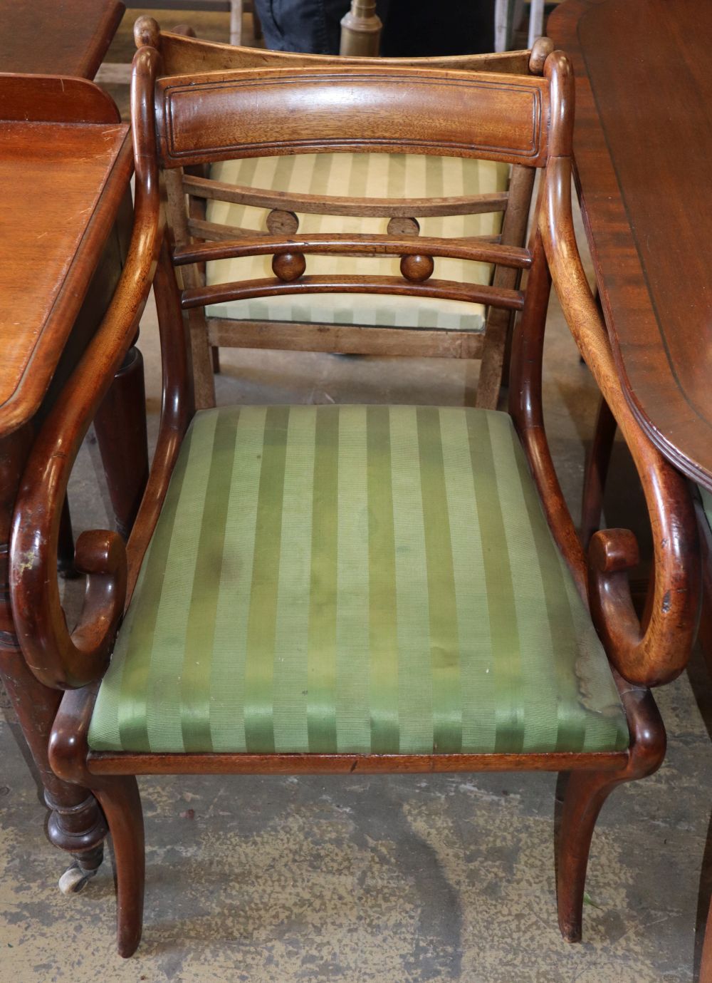 A set of eight Regency mahogany dining chairs (two with arms)